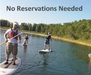 Rent stand up paddleboards from Alpine Accessories at The Board House at Three Oaks Recreation Area in Crystal Lake